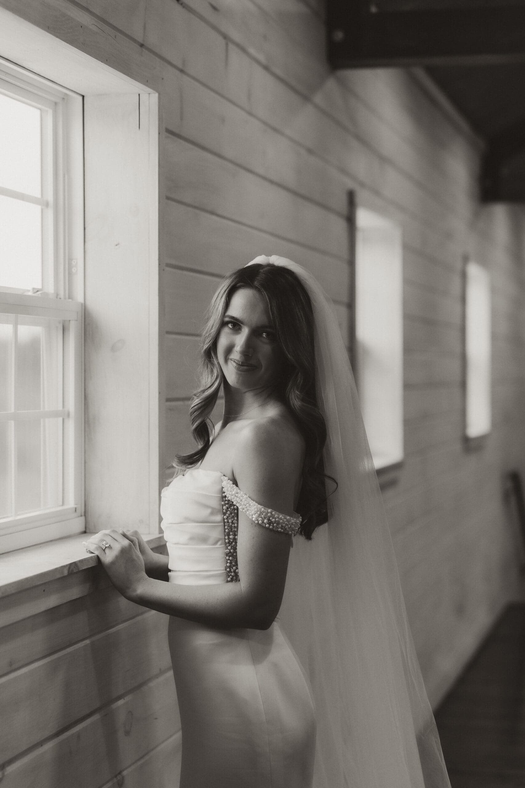 Bridal portrait by window with natural light at The Silver Spoon Barn