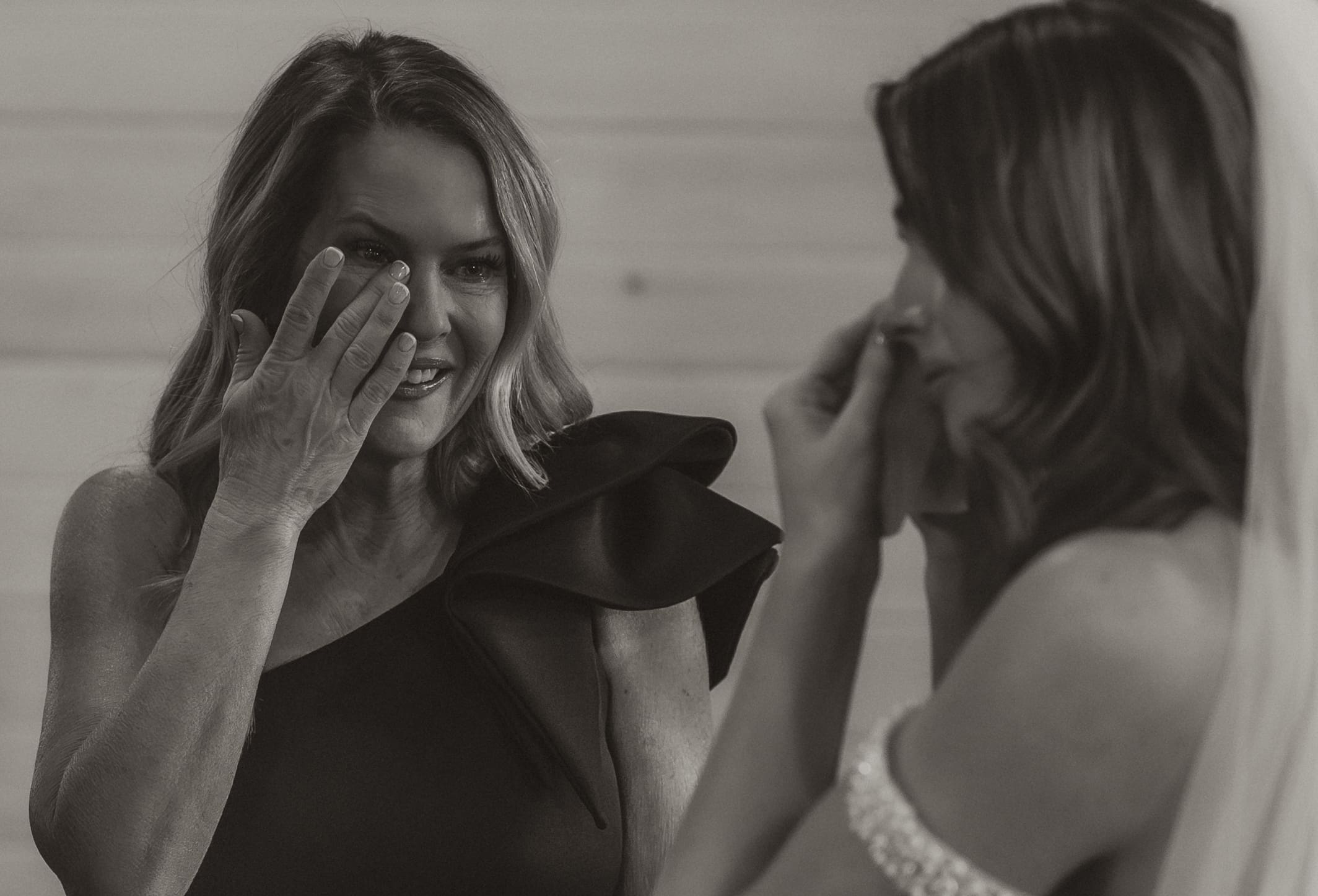 Bride and mother sharing emotional first look before ceremony at The Silver Spoon Barn
