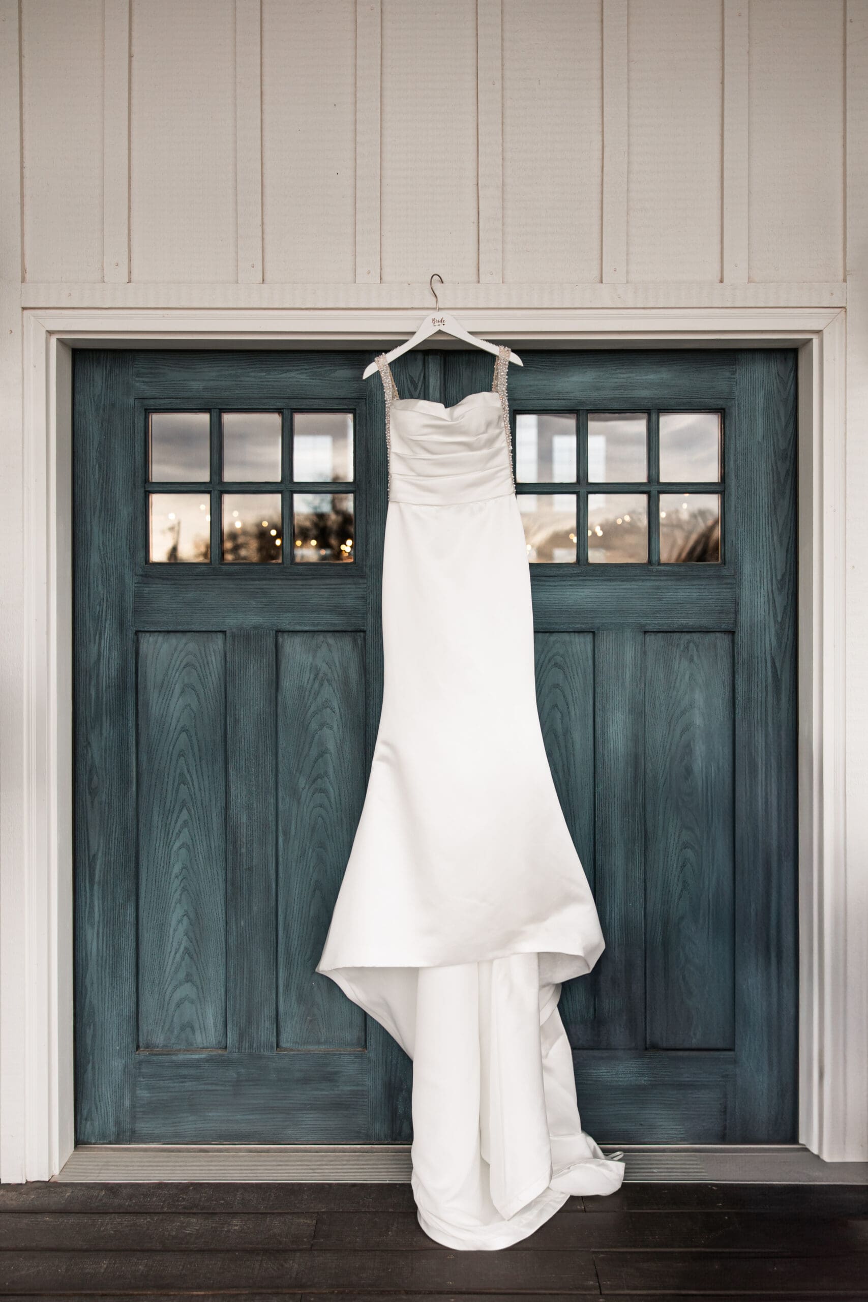 Bride’s wedding dress hanging at The Silver Spoon Barn