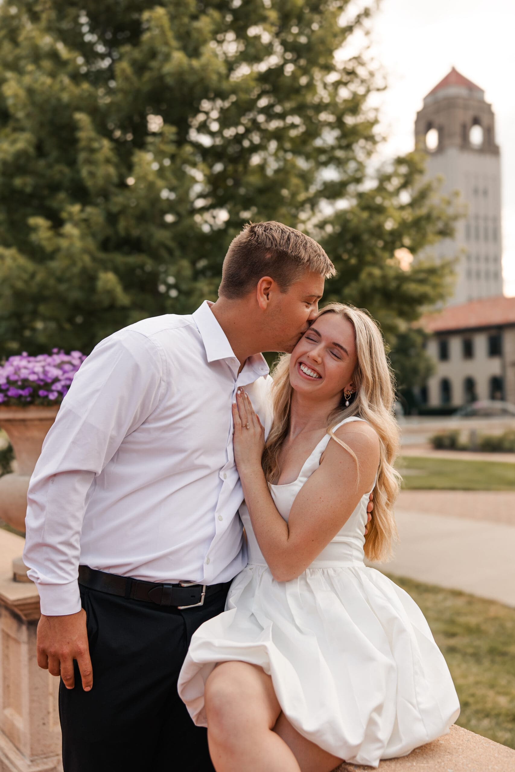 Candid moment between bride and groom during engagement session at Unity Village