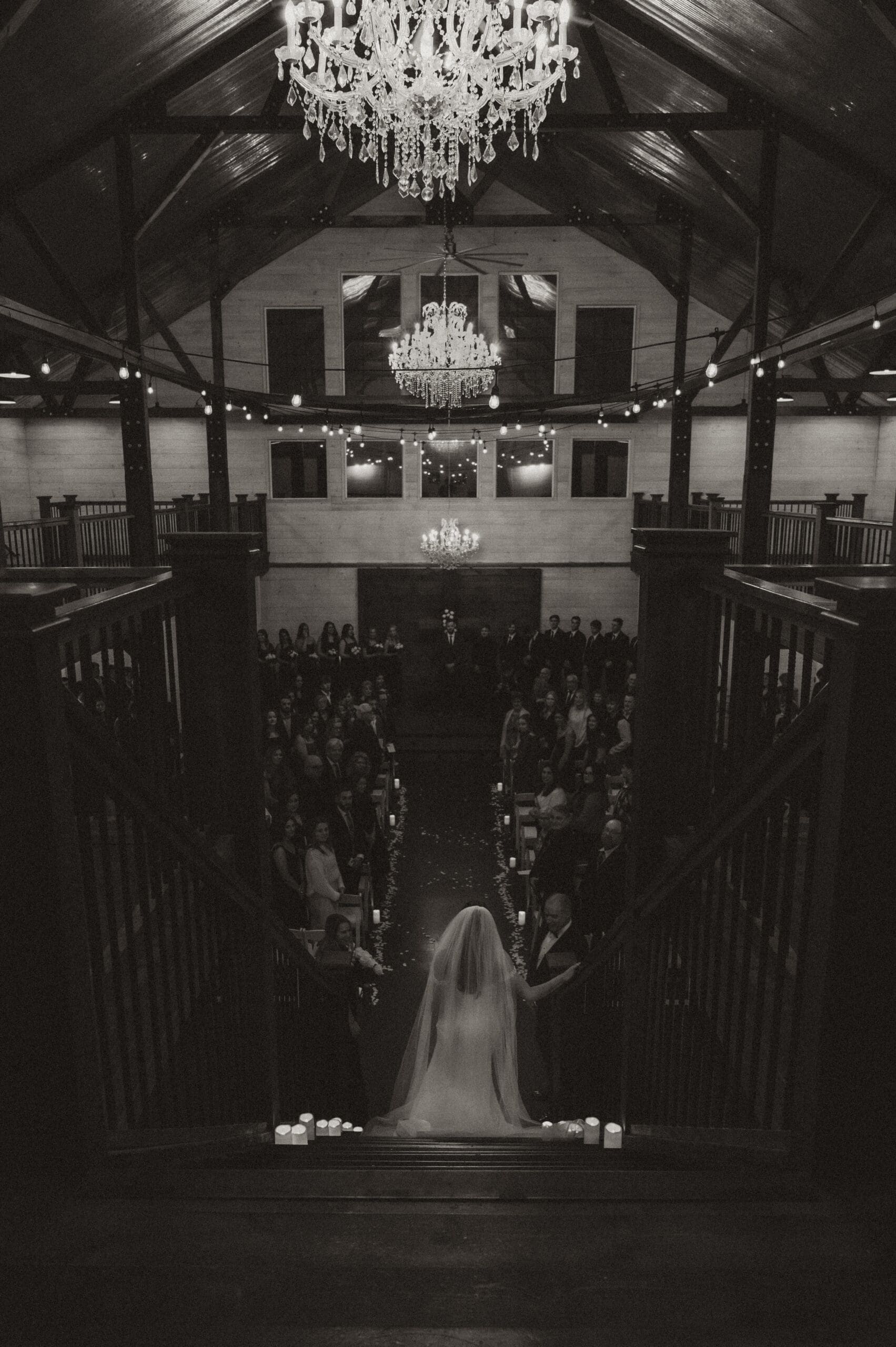 Bride walking down staircase during winter wedding at The Silver Spoon Barn
