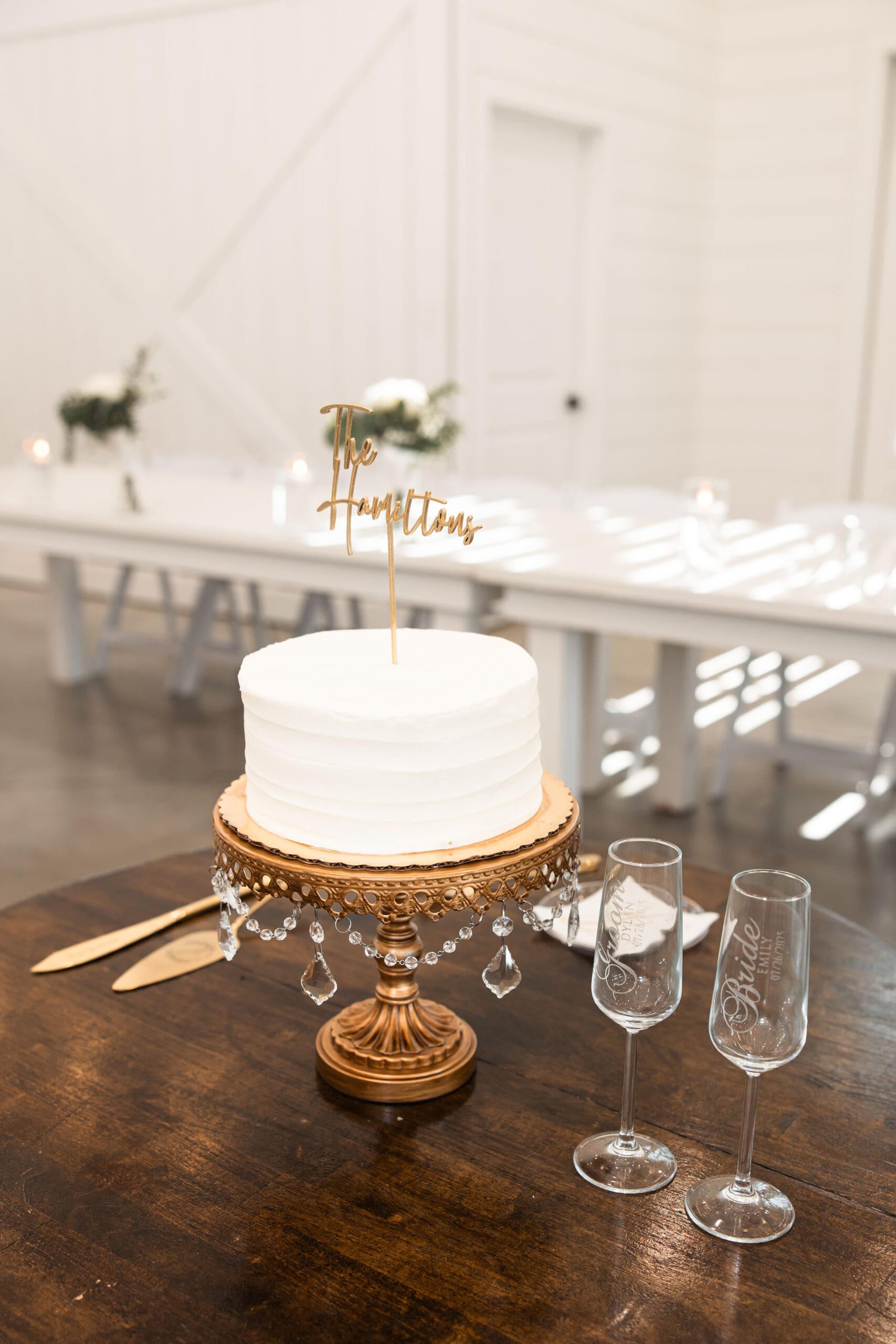 Wedding cake and champagne glasses Barn at Grace Hill reception.
