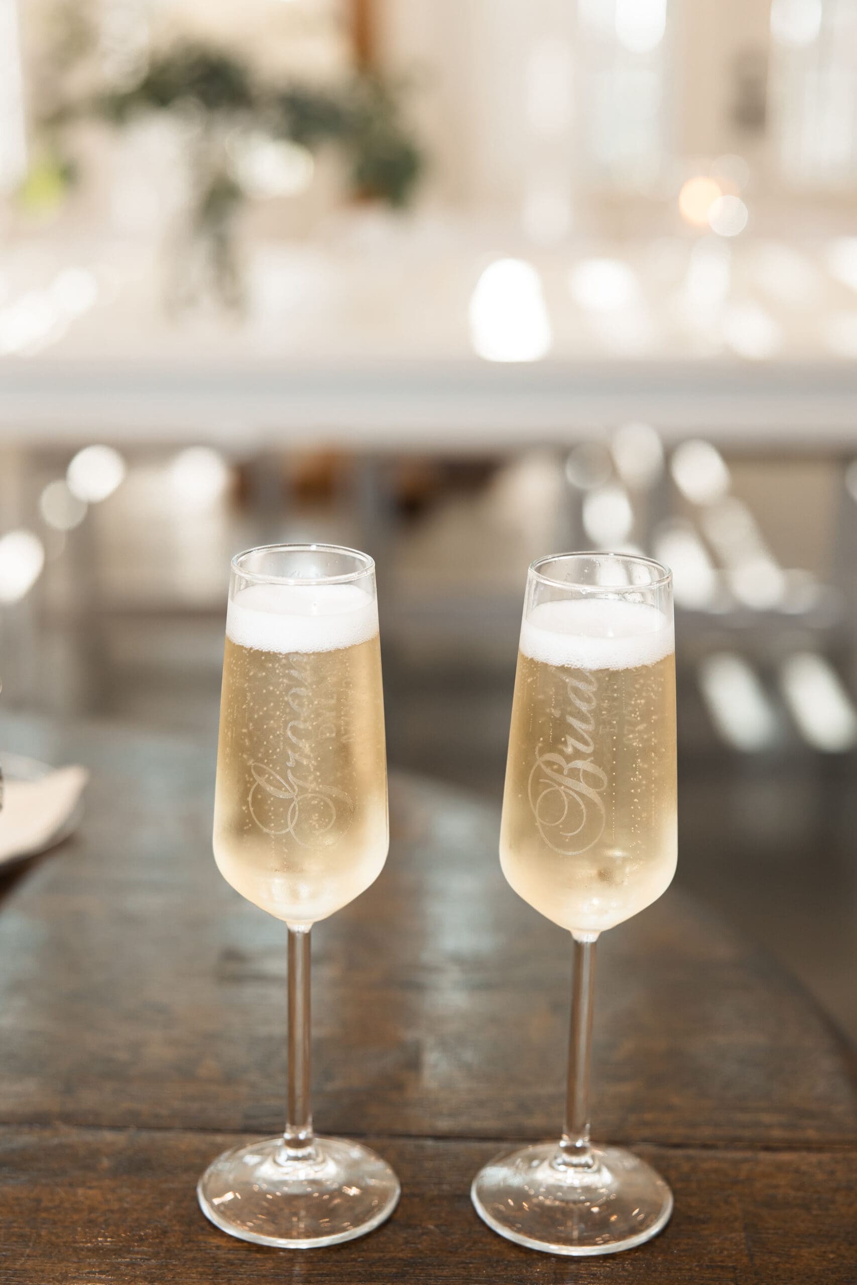 Bride and groom champagne glasses detail Barn at Grace Hill.