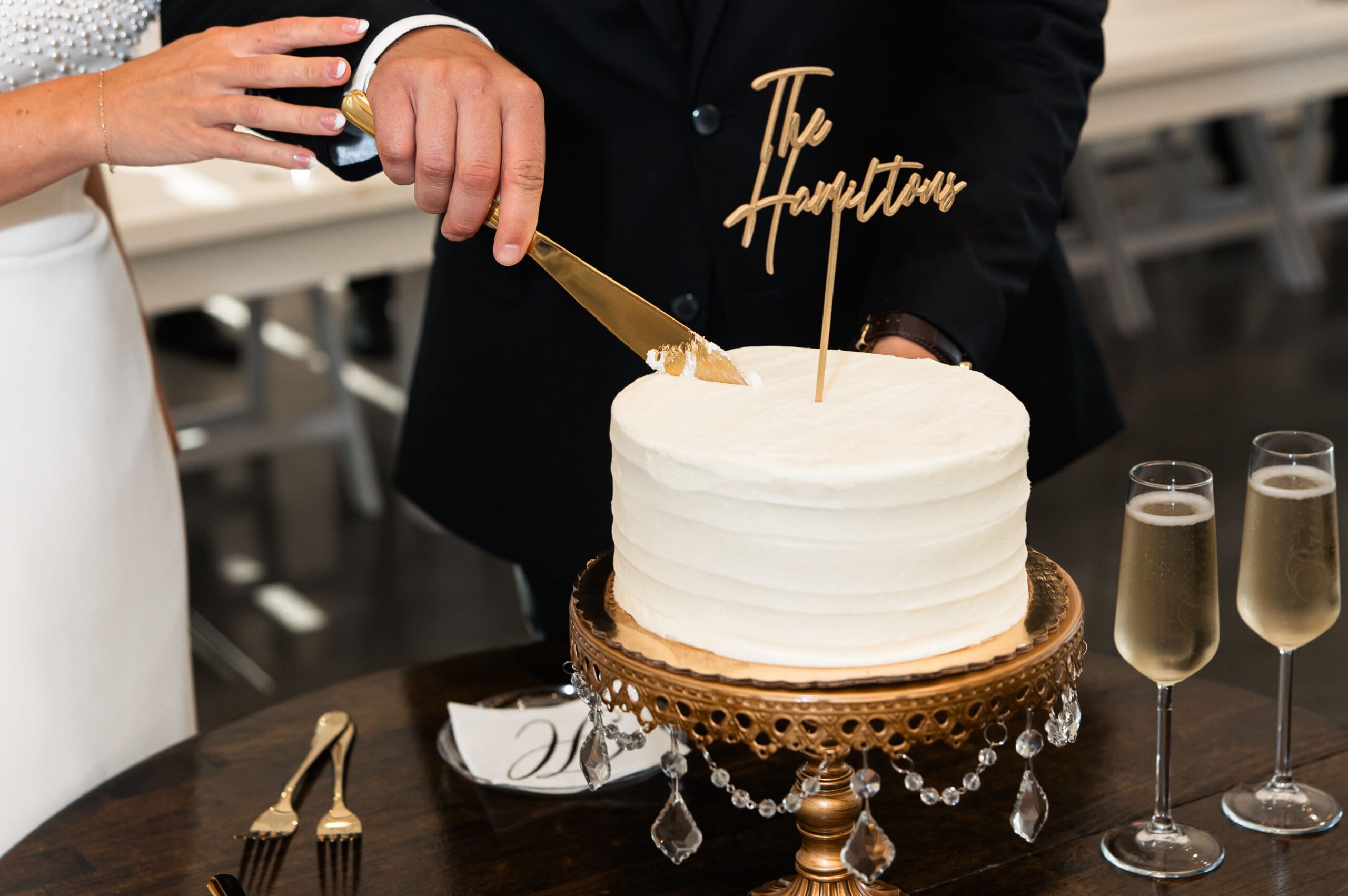 Cake cutting at Barn at Grace Hill wedding reception.
