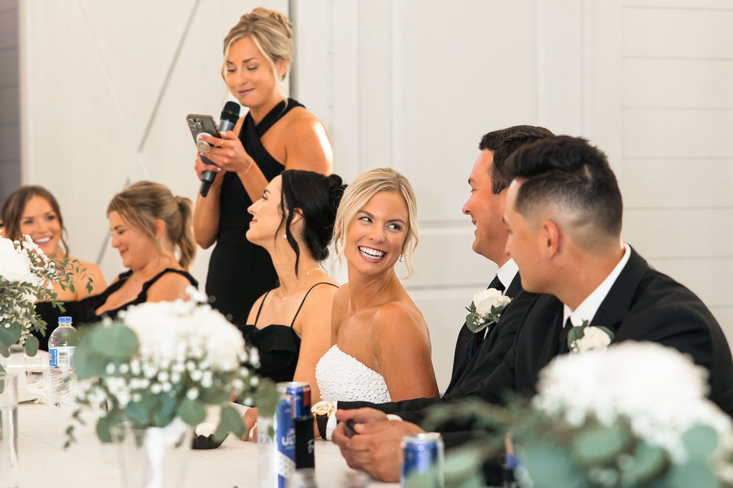 Bride laughing during maid of honor speech Barn at Grace Hill.