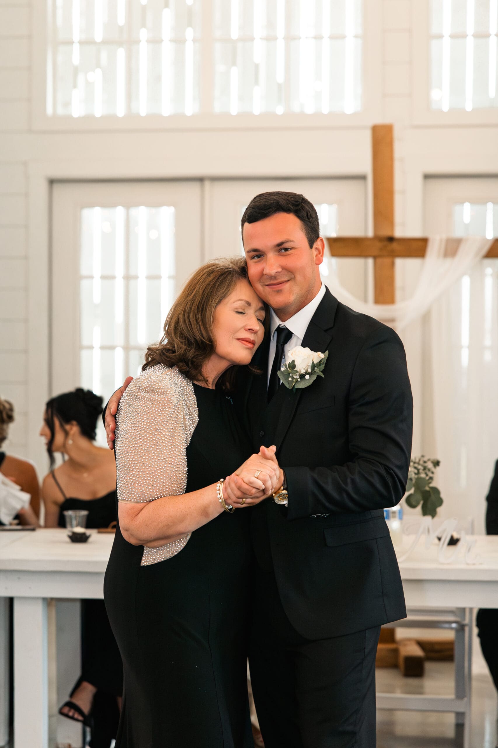 Groom and mother first dance Barn at Grace Hill wedding reception.