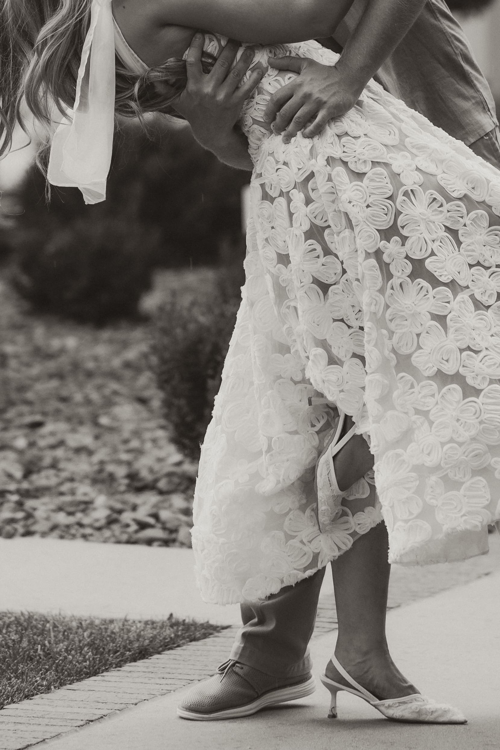Close-up of romantic dip kiss with emotional expressions. Wichita Engagement Photographer