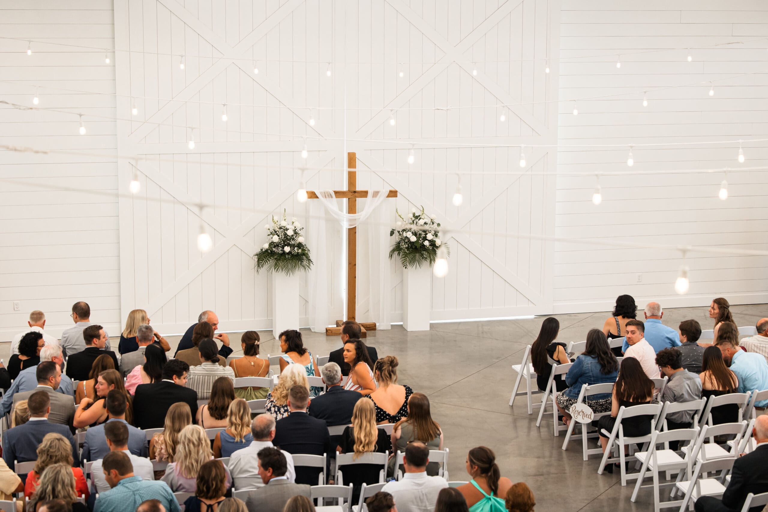 Ceremony space filled with guests Barn at Grace Hill wedding.