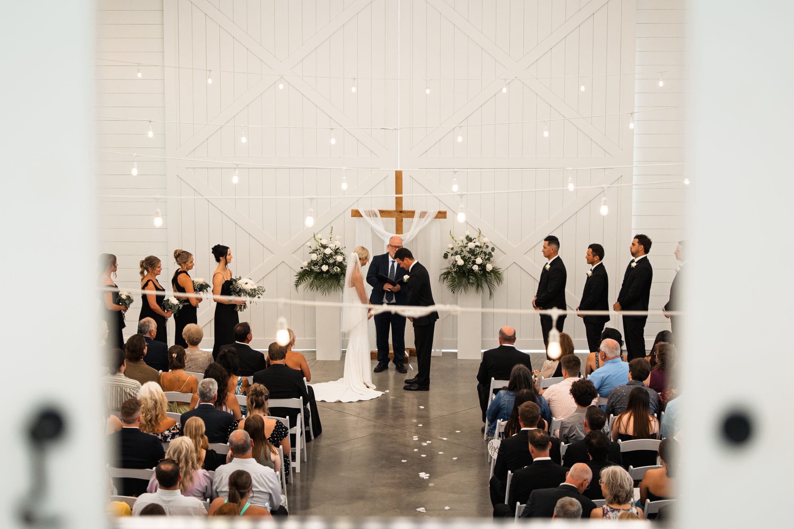 Bride and groom exchanging rings Barn at Grace Hill ceremony.