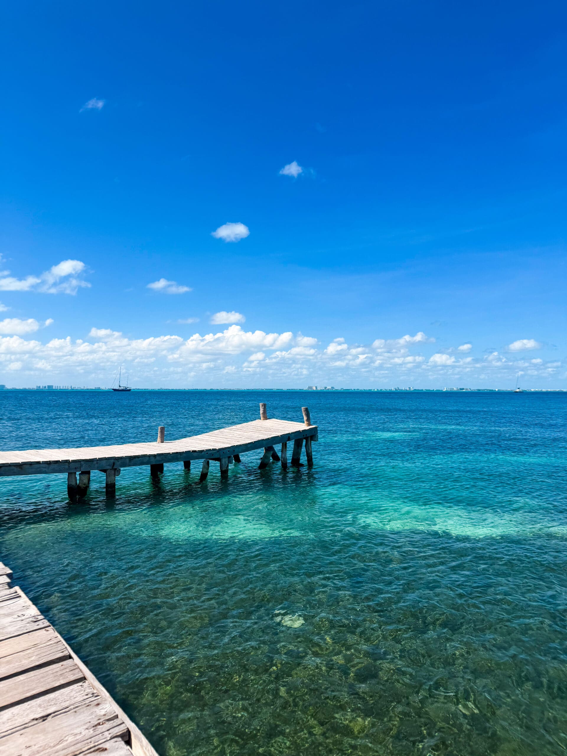 Dock and crystal blue water at Isla Mujeres, Mexico