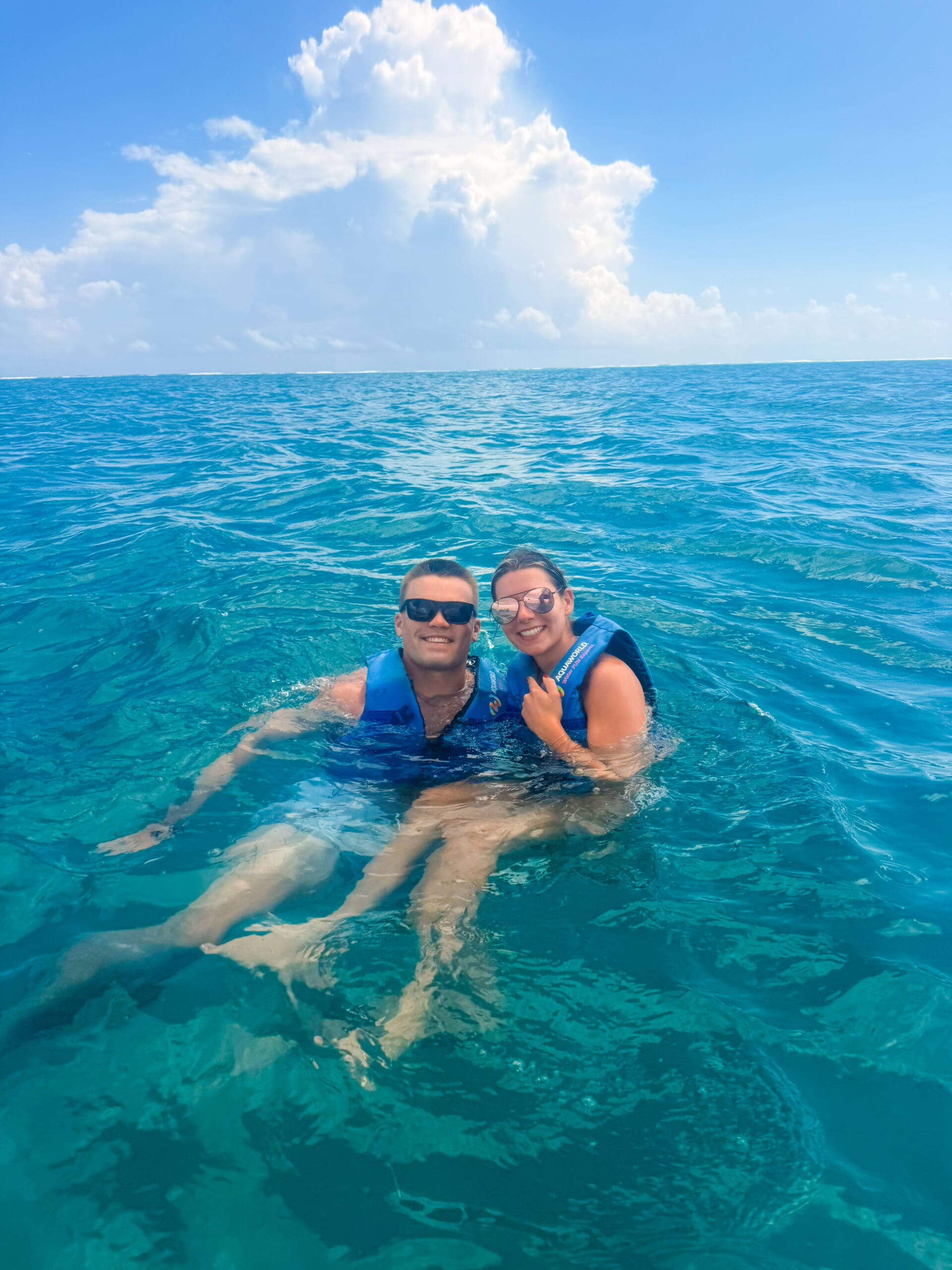 Smiling in the ocean after sailing on Hobie Cat from AquaWorld Cancun