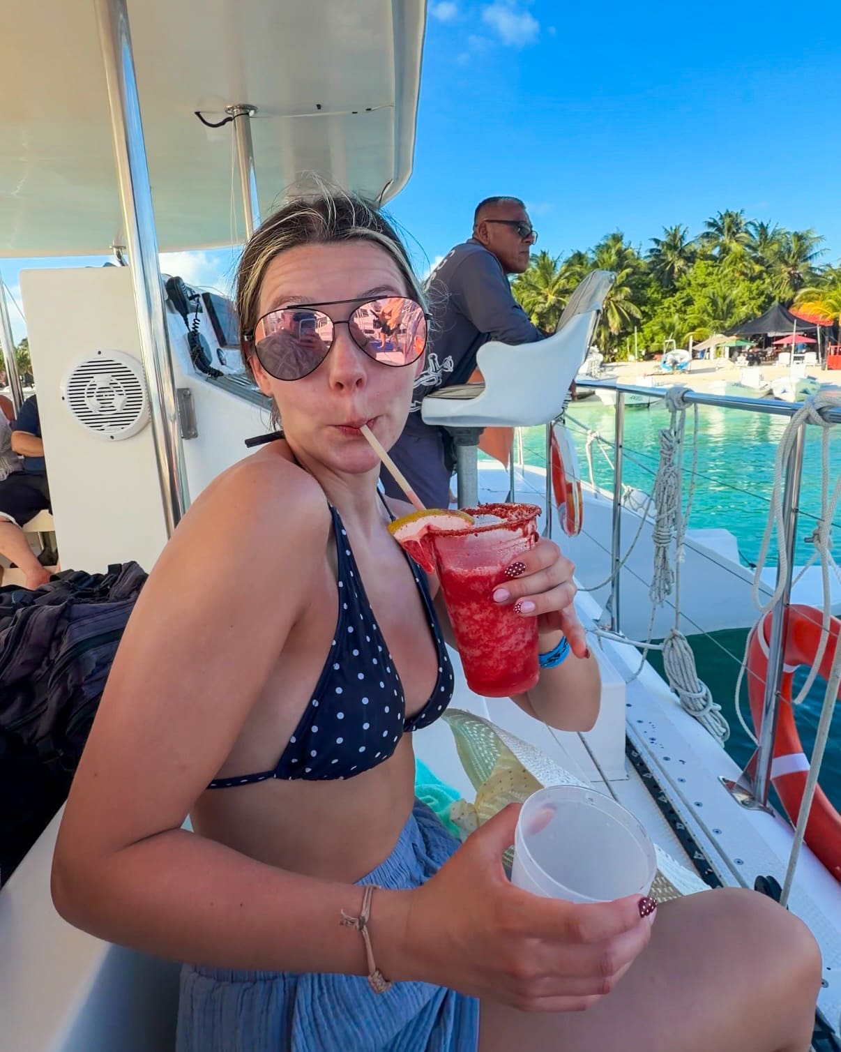 Drinking strawberry margarita at Isla Mujeres during honeymoon excursion