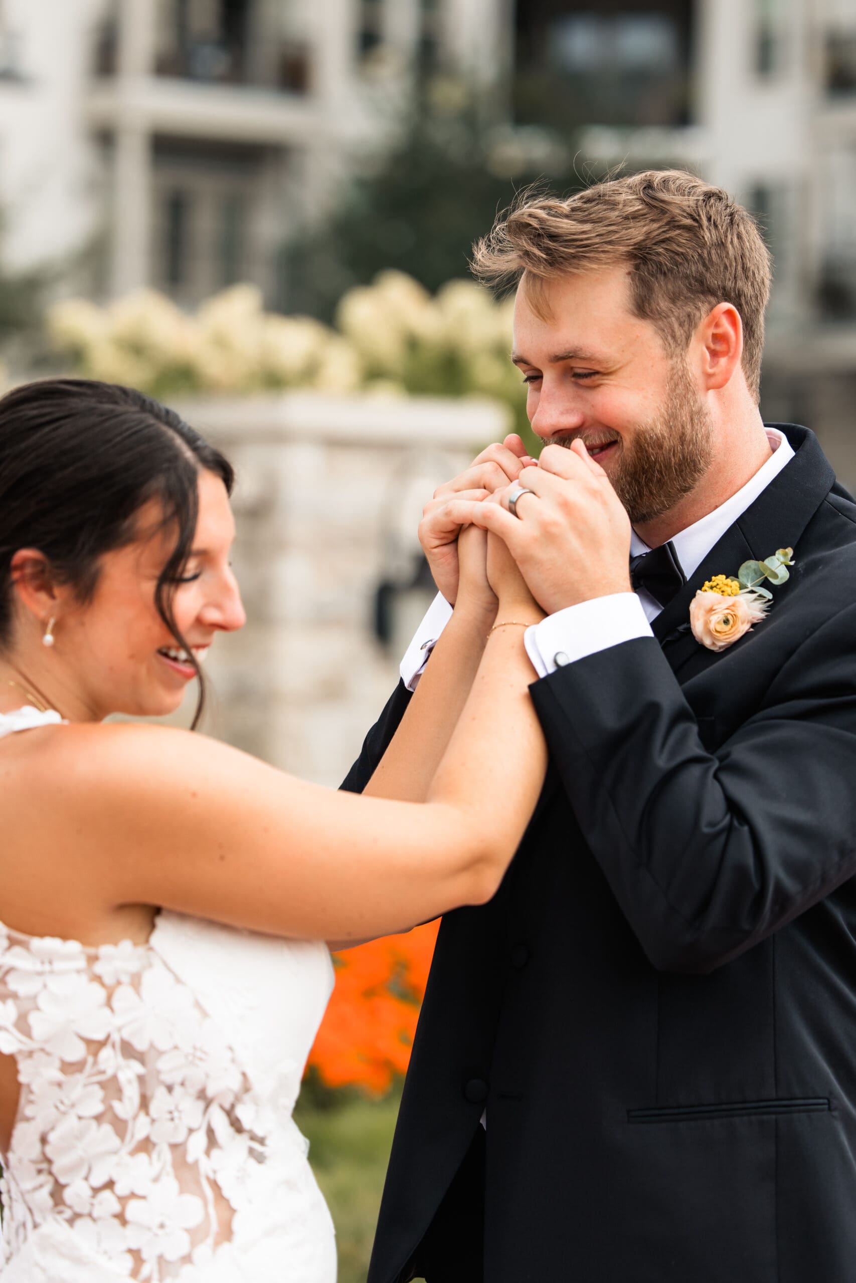 Bride and groom share a joyful, candid moment after their Meadowbrook Park wedding portraits in Overland Park, captured by Kansas luxury wedding photographer Briana Jewell Photography