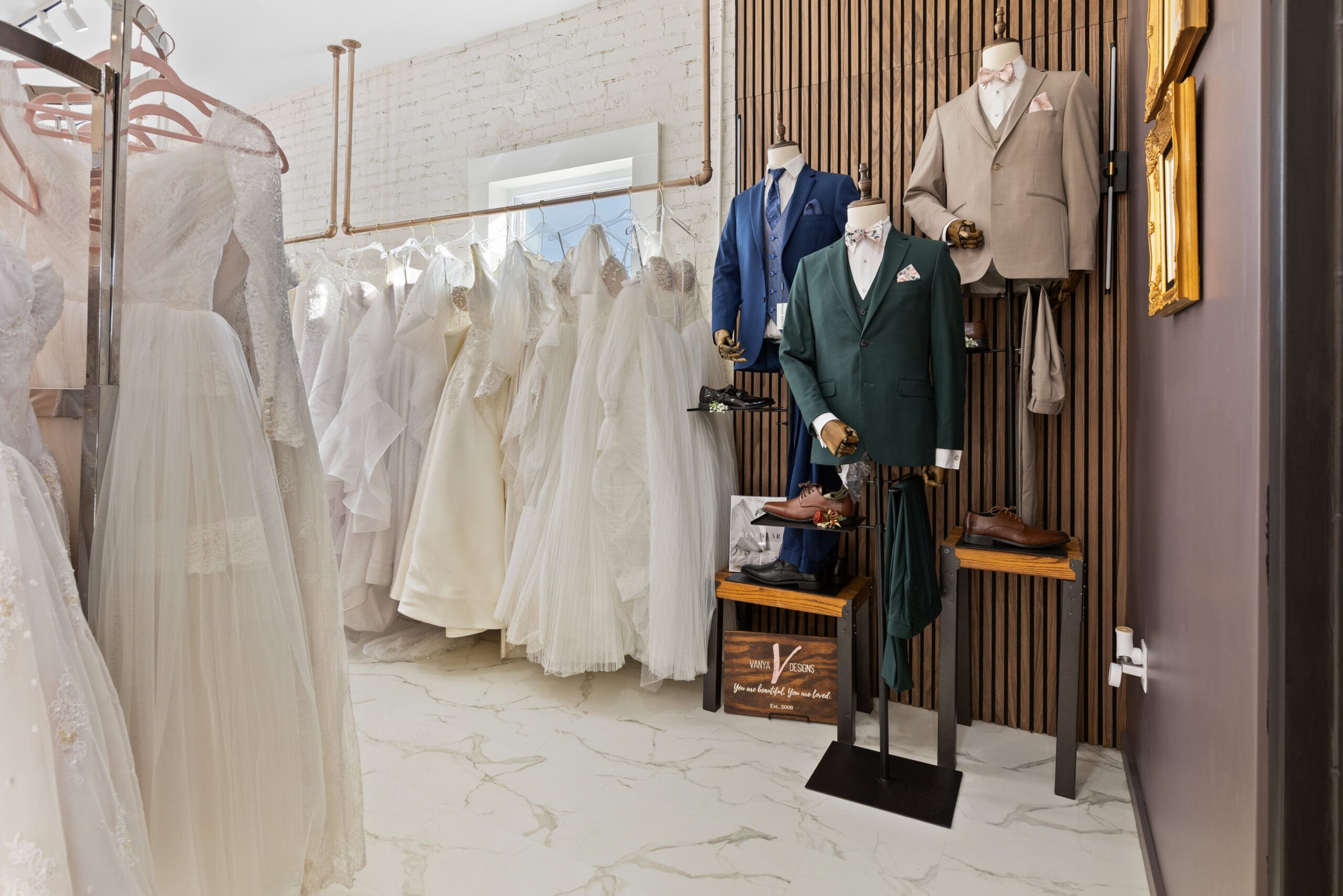 Custom wedding gowns and tuxedos on display at Vanya Designs, Wichita’s premier custom bridal atelier