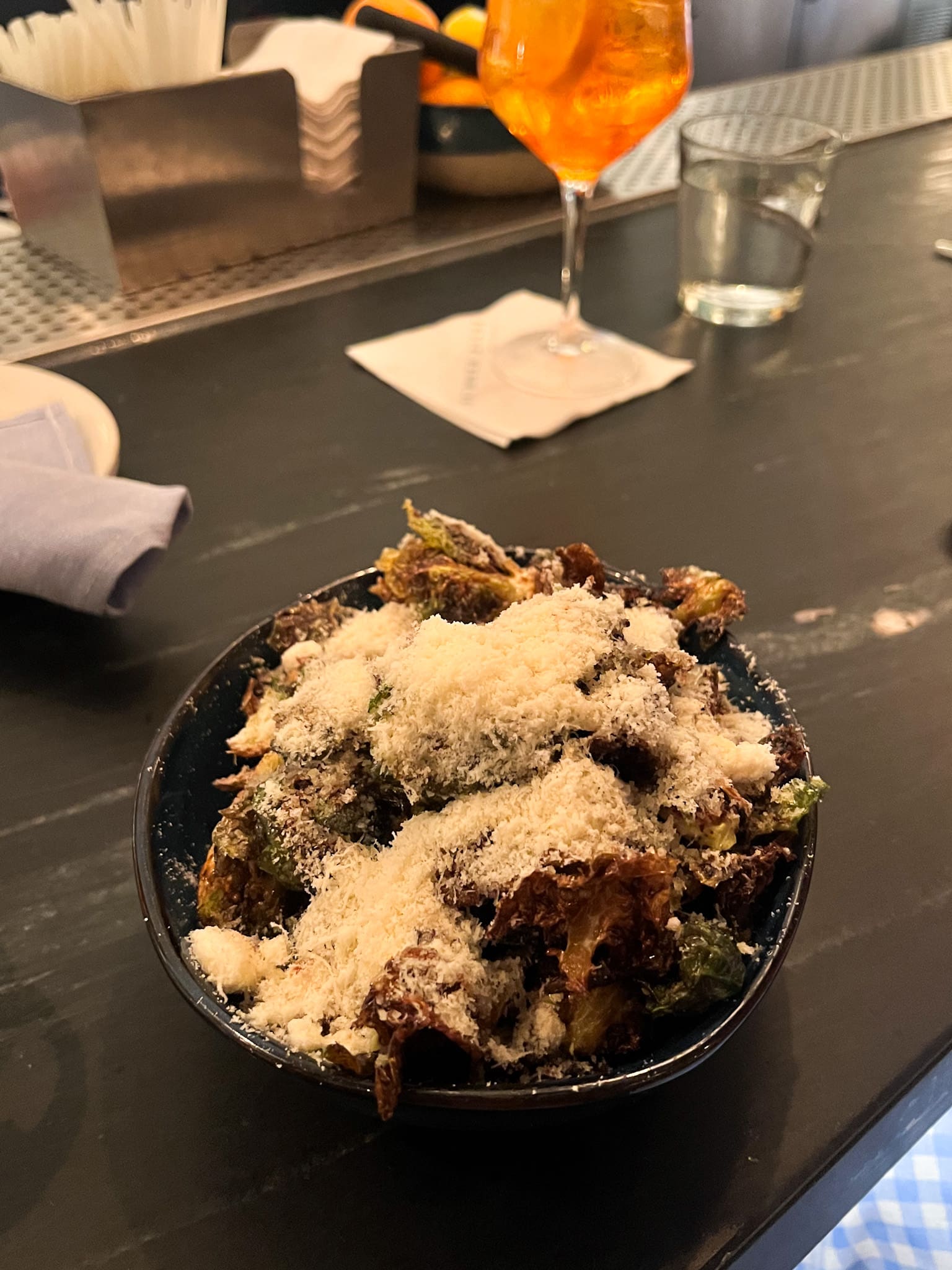 Crispy caramelized Brussels sprouts topped with parmesan cheese at Summer House on the Lake Disney Springs – standout dinner dish from Orlando trip